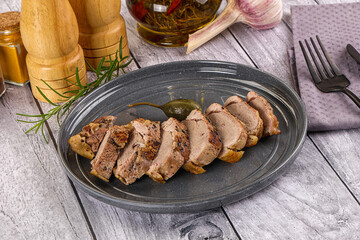 Roasted duck breast slices in the plate