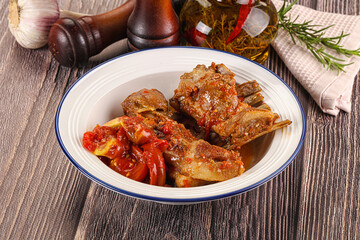 Baked lamb ribs with vegetables