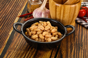 Baked white canned beans in the bowl