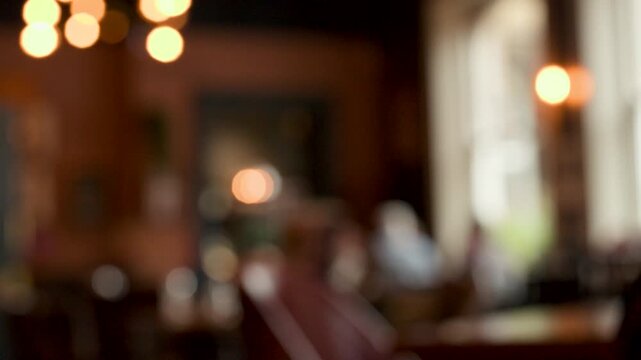 Bokeh View of Cozy English Caf&Atilde;&copy; Interior with Warm Lighting