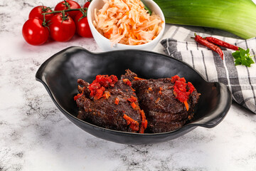 Baked beef cheeks with vegetables