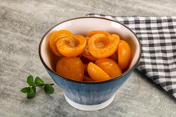 Sweet canned apricots with syrope