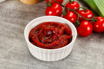 Red tomato paste in the bowl