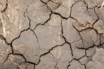 Cracked Dry Soil Texture with Deep Fissures, Drought Concept, Arid Land, Dehydrated Earth Surface, Climate Change Impact, Water Scarcity