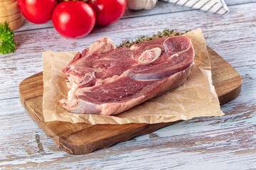 Raw lamb steak with bone