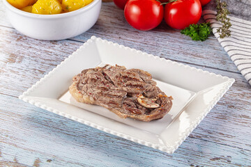 Grilled lamb steak with bone