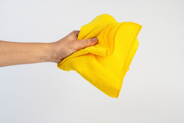 Yellow fiber cleaning cloth, new cloth ready to use on hand, white background