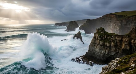 Ocean waves crashing against rocky cliffs under a cloudy sky near a green coastline view landscape