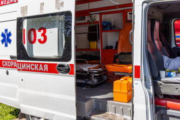 Ambulance interior with medical equipment and stretcher outdoors