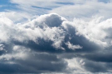 Obraz premium Dramatic storm clouds for the background. Isolated summer storm clouds before a thunderstorm. Dark storm clouds before the rain. Bad weather. A heavenly landscape of clouds in the sky on a rainy day.