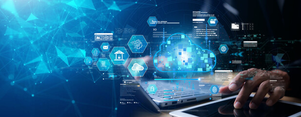 Futuristic cloud computing and artificial intelligence technology concept with business hand using digital tablet and laptop for data management, cybersecurity, and fintech network innovation.