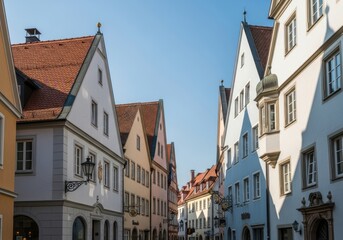 Obraz premium Charming european street with traditional architecture under a clear blue sky