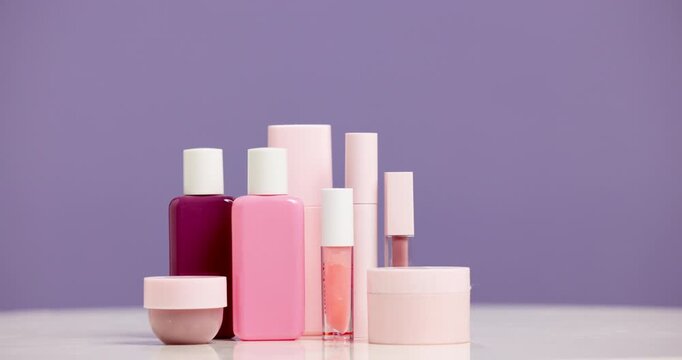 Bottle, cosmetics and advertising for beauty in studio, product and cosmetology mockup on purple background. Skincare, container and marketing for dermatology selection, makeup choice or presentation