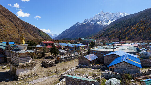 Stone village with prayer flags and stupa, Manang, Nepal