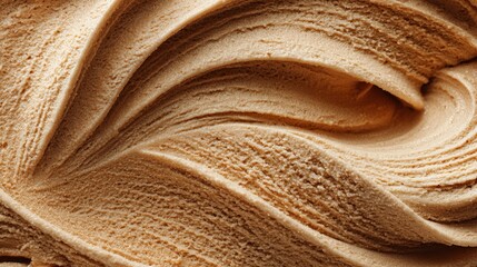 Close up view of swirling creamy light brown soft serve ice cream texture