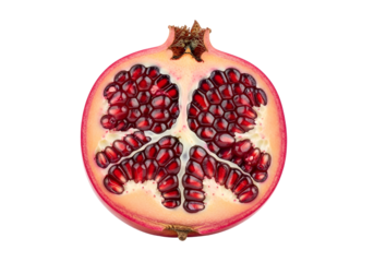 Close-up view of a pomegranate half, showcasing the intricate pattern of its ruby-red seeds against a pale pink interior.