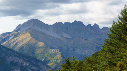 Rugged mountain peaks under a cloudy sky