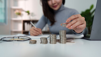 Coin Stacking: Woman Organizing Savings for Financial Growth