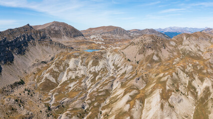 Rugged mountain landscape with a small blue lake