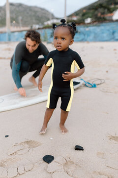 Little surfer on the beach