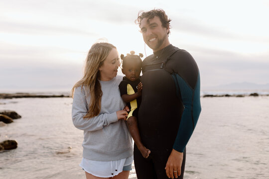 Diverse family on the Beach at sunrise