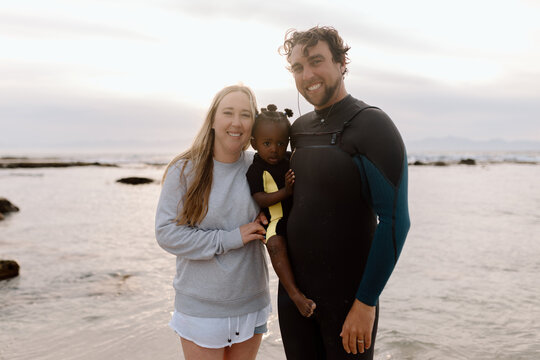 Diverse family on the Beach at sunrise