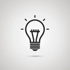 A light bulb icon featuring a shadow against a gray background