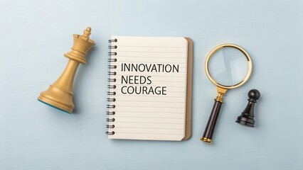 Notepad with Quote on Innovation Needs Courage Beside Chess Pieces Symbolizing Strategy and Growth