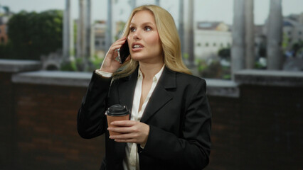 Woman talking on phone, holding coffee cup, in front of ancient roman ruins, wearing a black...