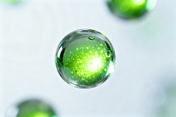 Green liquid bubbles on white background