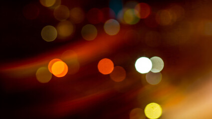 Abstract bokeh and light-leaks create a vibrant, atmospheric texture.