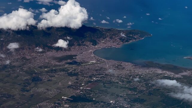 4k aerial video footage of area around City Cap-Ha&iuml;tien with Cap-Ha&iuml;tien International Airport, located on the north coast of Republic of Haiti on the island of Hispaniola in the Caribbean Sea