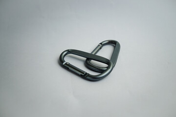 Climbing and hiking safety equipment. A close-up of two durable carabiners ready for adventure, isolated on white.