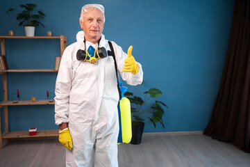 Elderly pest control worker killing insects inside infested house celebrating success with thumbs...