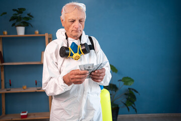 portrait of Elderly pest control worker killing insects counting cash money or his salary inside infested house. Exterminator in protective suit holding spray bottle with insecticide