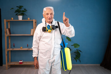 Happy Elderly pest control worker suggesting great idea, raise finger up inside infested house....