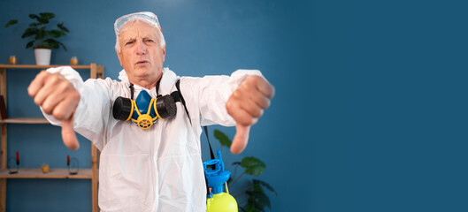 sad dissatisfied Elderly pest control worker showing thumbs down dislike gesture inside infested...