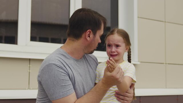 Upset little girl, emotional talk with dad, father consoles daughter, caring father, parental empathy, emotions in family, childhood distress, loving parent, father&rsquo;s responsibility, sad moment