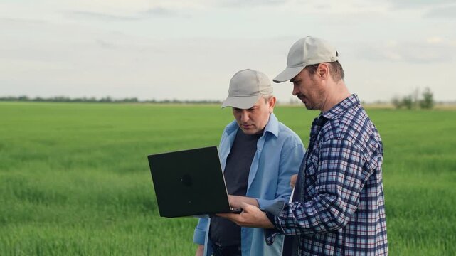 businessman farmer working field with laptop. partnership work. business partners talking about deal. agricultural industry farmer, digital computer, business transaction, conversation farmer field