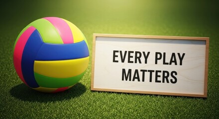 Volleyball and Sign on Green Grass with Motivational Message
