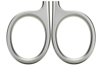 Close-up of brushed metal finger rings on a pair of scissors on a transparent background
