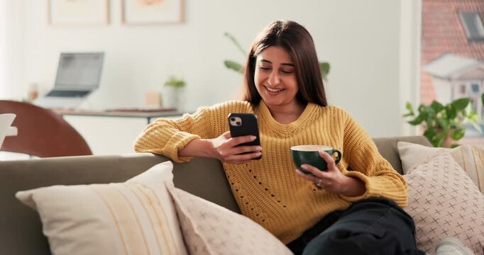 Happy woman, phone and coffee on sofa with texting, funny chat and relax with online dating in lounge. Person, smartphone and tea cup with contact, mobile app and smile with social media at apartment