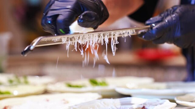 Preparing delicious cheese for tacos in a busy kitchen