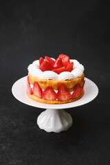 Strawberry shortcake on white cake stand dessert concept for party table decoration or celebration menu