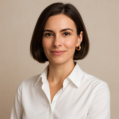 Professional woman portrait in white shirt with soft neutral background
