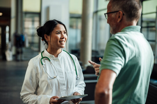 Doctor and patient during medical consultation at clinic indoors