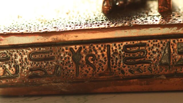 A close-up shot of a metal object on a table, perfect for highlighting details or adding texture to your design