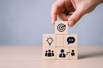 Concept of business strategy with wooden blocks depicting goals, ideas, communication, teamwork, and partnership