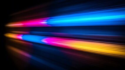 Abstract streaks of vibrant blue pink and yellow light blur across dark background
