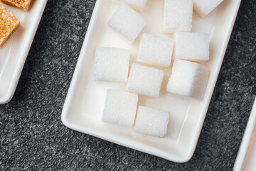 White sugar cubes arranged neatly on a serving tray ready for desserts